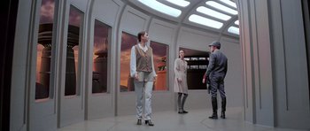 Movie still from “Star Wars: Episode V - The Empire Strikes Back” (1980), directed by Irvin Kershner – A group of people standing in a room with windows; Wide shot, High angle