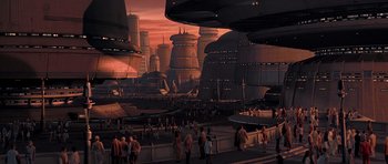 Movie still from “Star Wars: Episode V - The Empire Strikes Back” (1980), directed by Irvin Kershner – People are standing in a large city at sunset; Extreme Wide shot, High angle