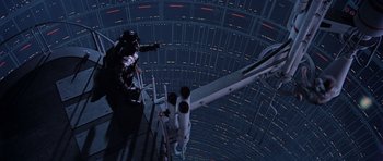 Movie still from “Star Wars: Episode V - The Empire Strikes Back” (1980), directed by Irvin Kershner – A man standing on a platform in a space station; Wide shot, Overhead angle