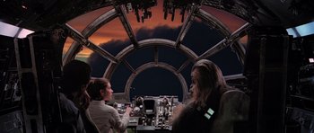 Movie still from “Star Wars: Episode V - The Empire Strikes Back” (1980), directed by Irvin Kershner – A group of people sitting inside of an airplane; Wide shot, Low angle