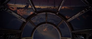 Movie still from “Star Wars: Episode V - The Empire Strikes Back” (1980), directed by Irvin Kershner – A view from inside an airplane of a cloudy sky; Extreme Wide shot, Low angle
