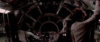 Movie still from “Star Wars: Episode V - The Empire Strikes Back” (1980), directed by Irvin Kershner – The interior of a star wars ship with the cockpit; Wide shot, Over the shoulder angle