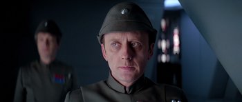 Movie still from “Star Wars: Episode V - The Empire Strikes Back” (1980), directed by Irvin Kershner – A person wearing a helmet; Close Up shot, Low angle