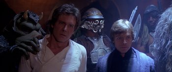 Movie still from “Star Wars: Episode VI - Return of the Jedi” (1983), directed by Richard Marquand – A group of men standing next to each other; Close Up shot, Over the shoulder angle