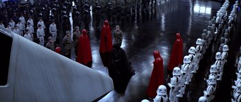 Movie still from “Star Wars: Episode VI - Return of the Jedi” (1983), directed by Richard Marquand – A group of people dressed as darth vader and stormtroopers; Extreme Wide shot, High angle