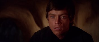 Movie still from “Star Wars: Episode VI - Return of the Jedi” (1983), directed by Richard Marquand – A person wearing a black shirt; Close Up shot, Over the shoulder angle