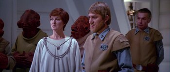 Movie still from “Star Wars: Episode VI - Return of the Jedi” (1983), directed by Richard Marquand – A man and a woman standing next to each other; Medium shot, Over the shoulder angle