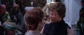 Movie still from “Star Wars: Episode VI - Return of the Jedi” (1983), directed by Richard Marquand – A young woman and a young man are looking into each others eyes; Close Up shot, Over the shoulder angle