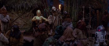 Movie still from “Star Wars: Episode VI - Return of the Jedi” (1983), directed by Richard Marquand – A group of people dressed as star wars characters; Wide shot, Low angle