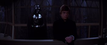 Movie still from “Star Wars: Episode VI - Return of the Jedi” (1983), directed by Richard Marquand – A man and a darth vader in a dark room; Medium shot, Low angle
