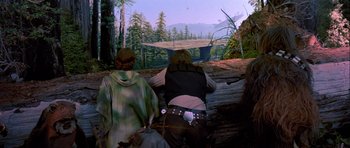 Movie still from “Star Wars: Episode VI - Return of the Jedi” (1983), directed by Richard Marquand – Two people standing in front of a painting of a forest; Wide shot, Low angle