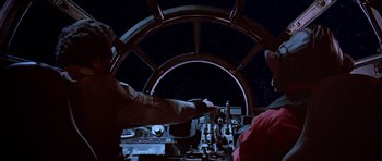 Movie still from “Star Wars: Episode VI - Return of the Jedi” (1983), directed by Richard Marquand – Two people are standing inside a ship at night; Medium shot, Overhead angle