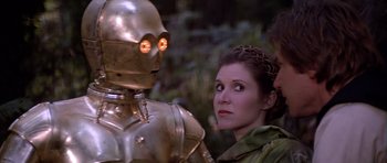Movie still from “Star Wars: Episode VI - Return of the Jedi” (1983), directed by Richard Marquand – A woman standing in front of a robot; Close Up shot, Over the shoulder angle