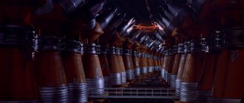 Movie still from “Star Wars: Episode VI - Return of the Jedi” (1983), directed by Richard Marquand – A bunch of pipes that are sitting in a room together; Extreme Wide shot, High angle
