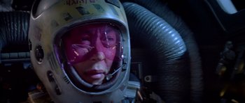 Movie still from “Star Wars: Episode VI - Return of the Jedi” (1983), directed by Richard Marquand – A person wearing a helmet and a mask in a room; Close Up shot, Low angle