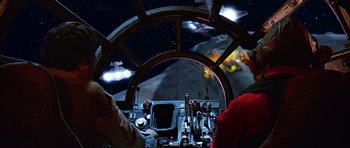 Movie still from “Star Wars: Episode VI - Return of the Jedi” (1983), directed by Richard Marquand – A view from inside a space ship at night time; Wide shot, Over the shoulder angle