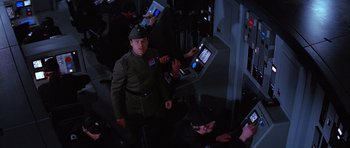 Movie still from “Star Wars: Episode VI - Return of the Jedi” (1983), directed by Richard Marquand – A group of people in a dark room; Medium shot, High angle