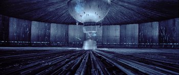 Movie still from “Star Wars: Episode VI - Return of the Jedi” (1983), directed by Richard Marquand – A large metal object sitting on top of train tracks; Extreme Wide shot, High angle