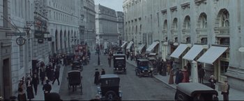 Movie still from “Suffragette” (2015), directed by Sarah Gavron – An image of an old time city street scene; Extreme Wide shot, High angle