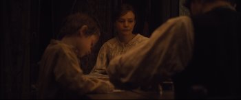 Movie still from “Suffragette” (2015), directed by Sarah Gavron – A young boy and a woman sitting at a dinner table; Medium shot, Over the shoulder angle
