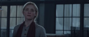 Movie still from “Suffragette” (2015), directed by Sarah Gavron – A woman standing in front of a window in a room; Close Up shot, Low angle