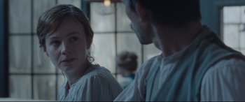 Movie still from “Suffragette” (2015), directed by Sarah Gavron – A woman and a man are looking at each other; Close Up shot, Over the shoulder angle