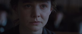 Movie still from “Suffragette” (2015), directed by Sarah Gavron – A woman's face with a dark background; Close Up shot, Over the shoulder angle