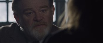 Movie still from “Suffragette” (2015), directed by Sarah Gavron – An older man with a beard looking at the camera; Close Up shot, Over the shoulder angle