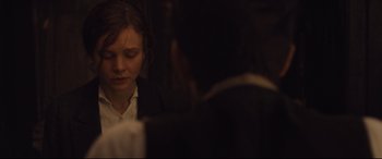 Movie still from “Suffragette” (2015), directed by Sarah Gavron – A woman sitting in front of a computer screen; Close Up shot, Over the shoulder angle