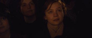 Movie still from “Suffragette” (2015), directed by Sarah Gavron – A young girl is looking into the distance; Close Up shot, Over the shoulder angle