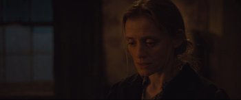 Movie still from “Suffragette” (2015), directed by Sarah Gavron – A person looking down at the ground; Close Up shot, Over the shoulder angle