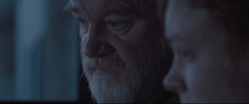 Movie still from “Suffragette” (2015), directed by Sarah Gavron – An old man with a beard is looking into the distance; Close Up shot, Over the shoulder angle