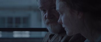Movie still from “Suffragette” (2015), directed by Sarah Gavron – An older man and a young girl looking at each other; Close Up shot, Over the shoulder angle
