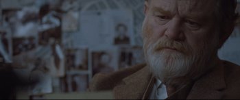 Movie still from “Suffragette” (2015), directed by Sarah Gavron – An old man with a beard and a white tie; Close Up shot, Over the shoulder angle