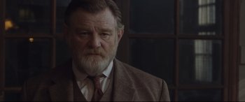 Movie still from “Suffragette” (2015), directed by Sarah Gavron – An old man with a beard and a suit; Close Up shot, Low angle