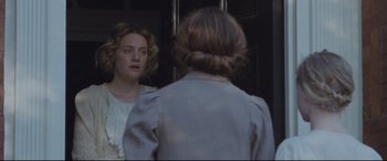 Movie still from “Suffragette” (2015), directed by Sarah Gavron – A woman standing in front of a mirror looking at herself in the mirror; Close Up shot, Over the shoulder angle