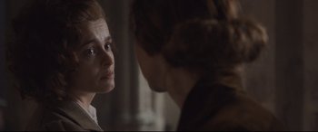 Movie still from “Suffragette” (2015), directed by Sarah Gavron – A woman looking at another woman in front of a mirror; Close Up shot, Over the shoulder angle