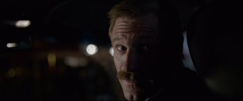 Movie still from “Sully” (2016), directed by Clint Eastwood – A person with a mustache; Close Up shot, Over the shoulder angle