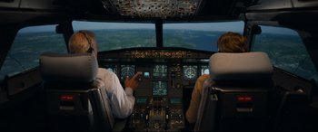 Movie still from “Sully” (2016), directed by Clint Eastwood – Two pilots in the cockpit of an airplane; Wide shot, High angle