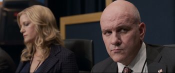 Movie still from “Sully” (2016), directed by Clint Eastwood – A man and a woman sitting in front of each other; Close Up shot, Over the shoulder angle