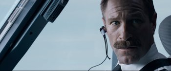 Movie still from “Sully” (2016), directed by Clint Eastwood – A person wearing a headset; Close Up shot, Low angle