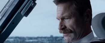 Movie still from “Sully” (2016), directed by Clint Eastwood – A person with a mustache; Close Up shot, Low angle