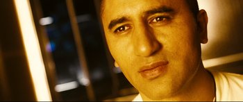 Movie still from “Sunshine” (2007), directed by Danny Boyle – A man's face with a blurry background; Close Up shot, Low angle