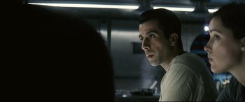 Movie still from “Sunshine” (2007), directed by Danny Boyle – A person in a kitchen; Close Up shot, Low angle