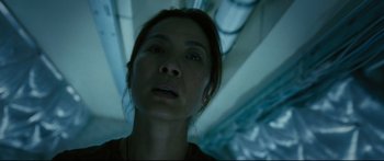 Movie still from “Sunshine” (2007), directed by Danny Boyle – A person looking at the camera; Close Up shot, Low angle