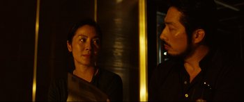 Movie still from “Sunshine” (2007), directed by Danny Boyle – A man and a woman looking at one another in a mirror; Close Up shot, Over the shoulder angle