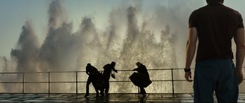 Movie still from “Sunshine” (2007), directed by Danny Boyle – A group of people standing next to each other on a pier; Extreme Wide shot, Low angle