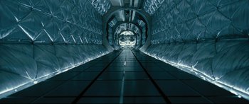 Movie still from “Sunshine” (2007), directed by Danny Boyle – An image of an empty tunnel in the middle of the night; Extreme Wide shot, Overhead angle