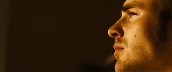Movie still from “Sunshine” (2007), directed by Danny Boyle – A man's face with his mouth open; Extreme Close Up shot, Low angle