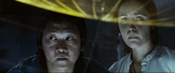 Movie still from “Sunshine” (2007), directed by Danny Boyle – A man and a woman looking out of a car window; Close Up shot, Low angle